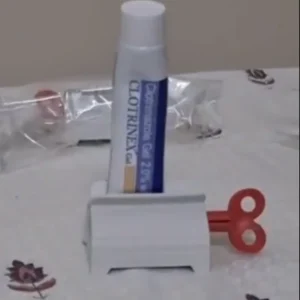 Toothpaste tube squeezer with stand holder