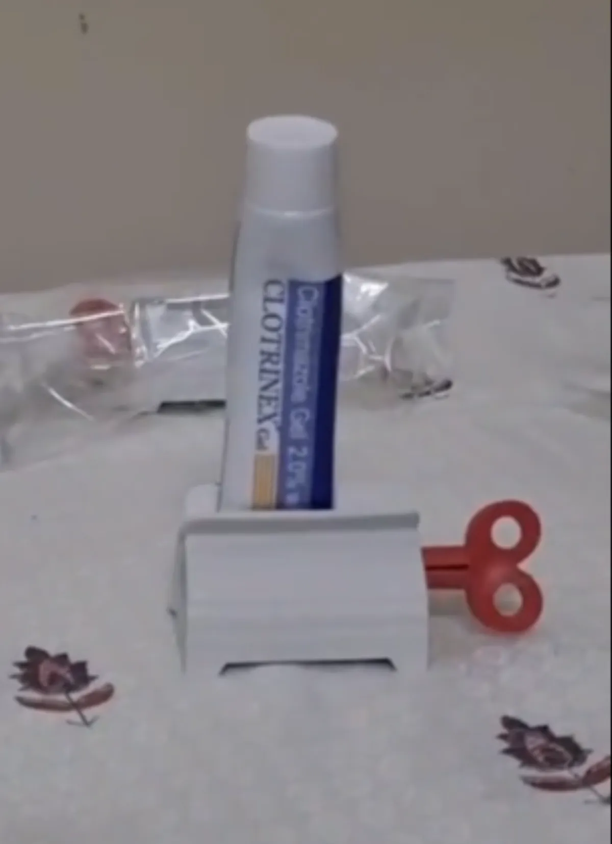 Toothpaste tube squeezer with stand holder